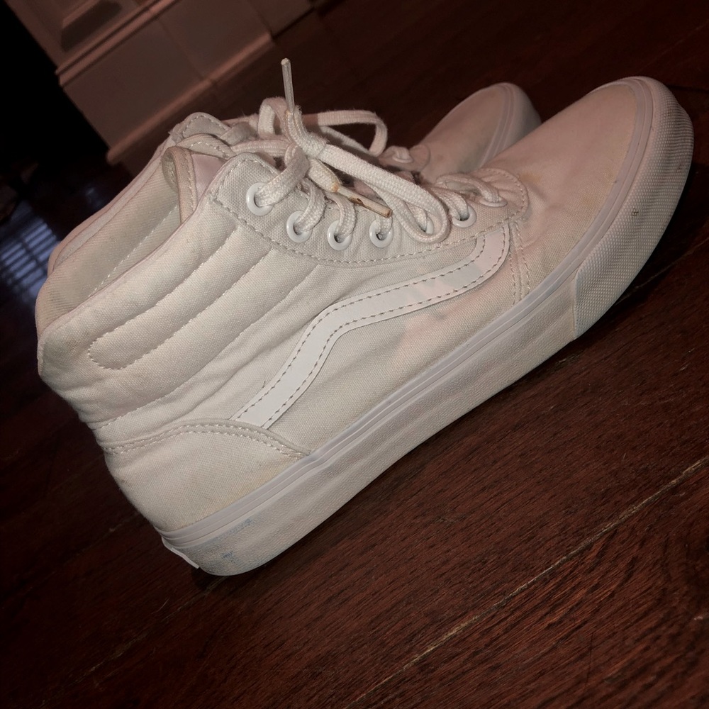 White ‘Vans’ tennis shoes